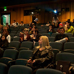 Students, faculty and guests await the start of the film.