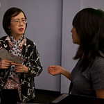 Rae talks with community leader, Monica Chang, following the screening.